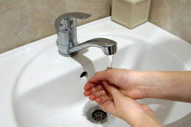 istock hand washing under the tap, close-up 1215484604