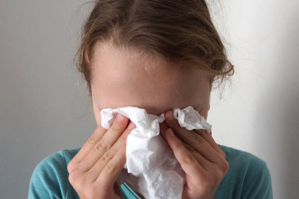 istock girl wipes her eyes with a napkin 1215484621