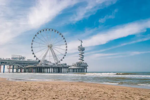 beach of Schevening Netherlands during Spring, The Ferris Wheel The Pier at Scheveningen in Netherlands, Sunny spring day at the beach Holland