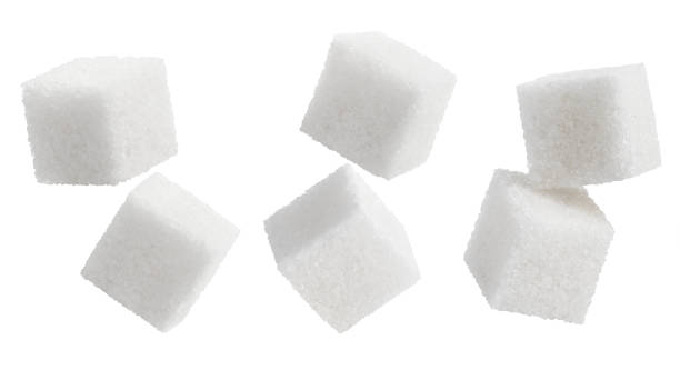 istock Collection of white sugar cubes on white 1215487270