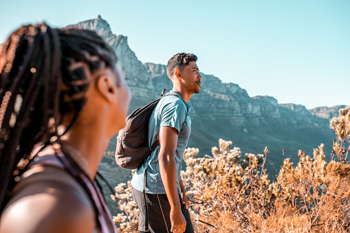 Two young people hiking Lions head, Cape Town