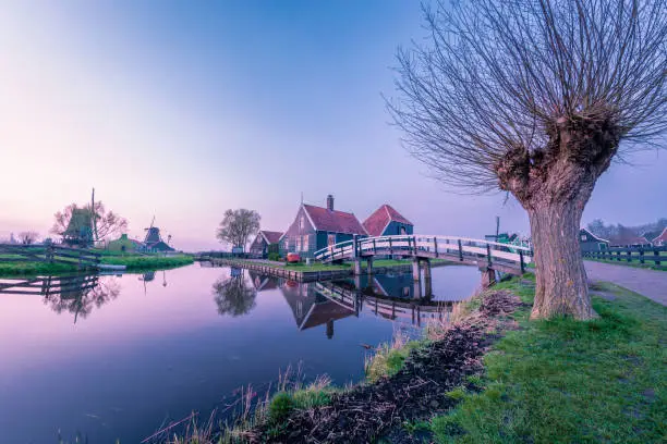 Photo of Zaanse Schans Netherlands a Dutch windmill village during sunset whit wooden house holland