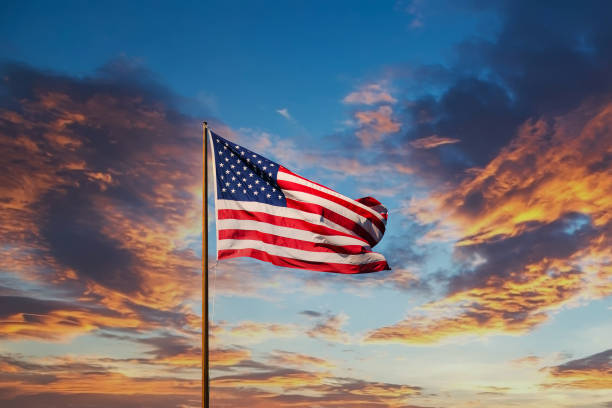 istock American Flag on Old Flagpole at Sunset 1215491567