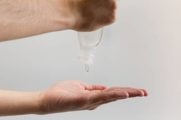 istock wash hands with hydroalcoholic gel to disinfect 1215491769
