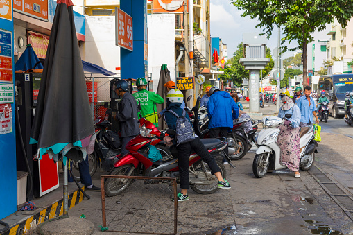 Ho Chi Minh, Vietnam - October 18, 2019 : Unidentified Vietnamese people refuel at gas station in Ho Chi Minh City, Vietnam on October 18, 2019.