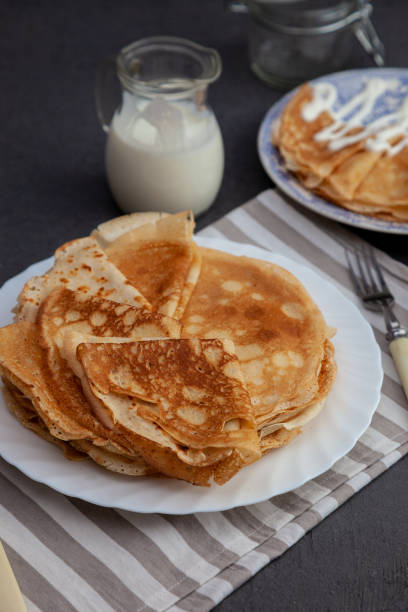 istock A stack of thin pancakes on a plate. Homemade pastries. Pancakes for breakfast. Appetizing food. Thin pancakes on a plate. Homemade crepes, tasty food. Staple of yeast pancakes 1215495876