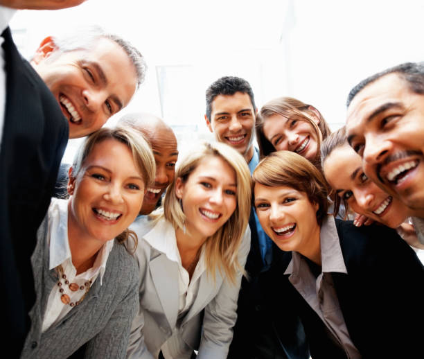 istock Group of executives laughing and smiling 121549909