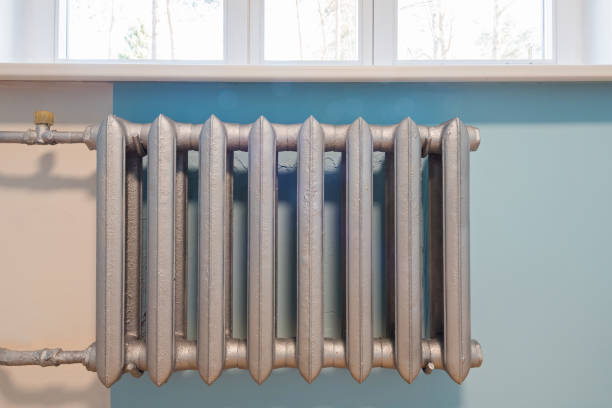 istock Cast iron radiator of water on the wall 1215499158