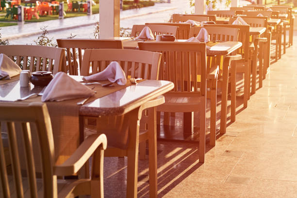 Empty terrace with a table and chairs outdoor in sunset
