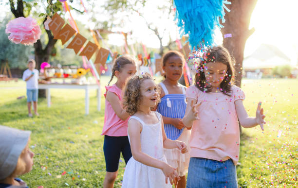 istock Small children outdoors in garden in summer, playing. 1215501021