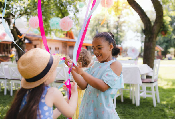 istock Small children outdoors in garden in summer, playing. 1215501041