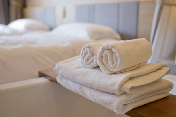 istock cleaning hotel, bath towel on white bed, room service 1215501116
