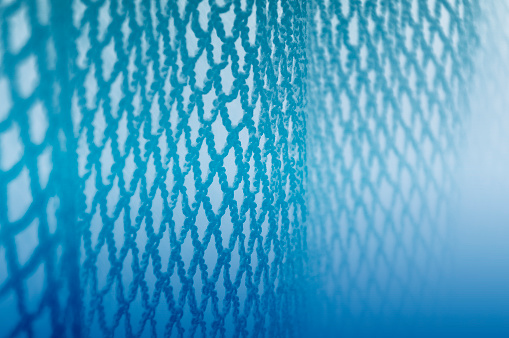 Abstract Underwater Blue Fishing Net