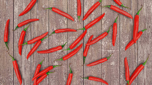 istock Red chili pepper wooden background. Flat lay, top view 1215501202