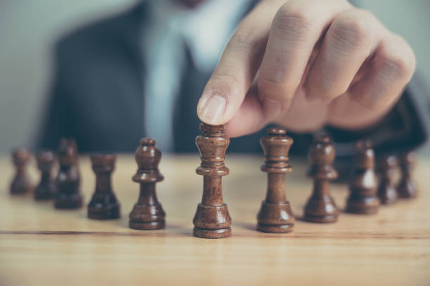 istock Businessman with chess board game. Plan strategy and tactic concept 1215502232