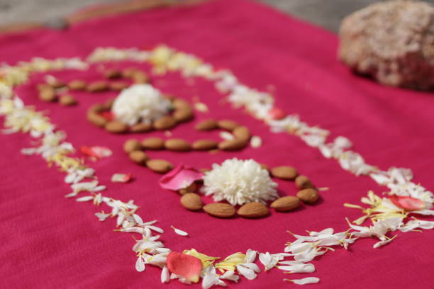 istock create 2020 with almonds and flowers on pink background 1215503200