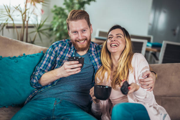 istock Couple in love sitting on the sofa, having fun. 1215503256