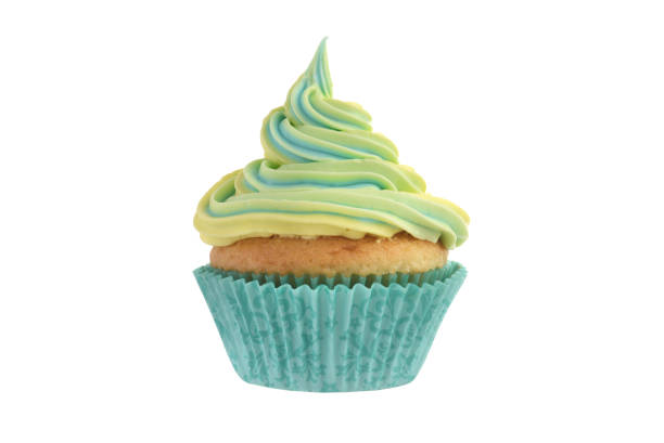 istock closeup isolated yellow and blue swirl cupcake 1215503279