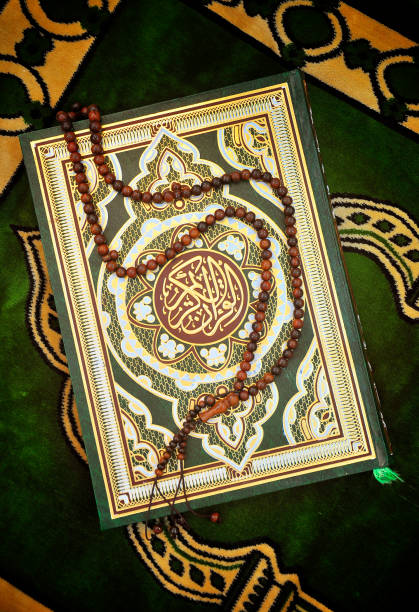 istock Holy Quran Book With Rosary 1215503637