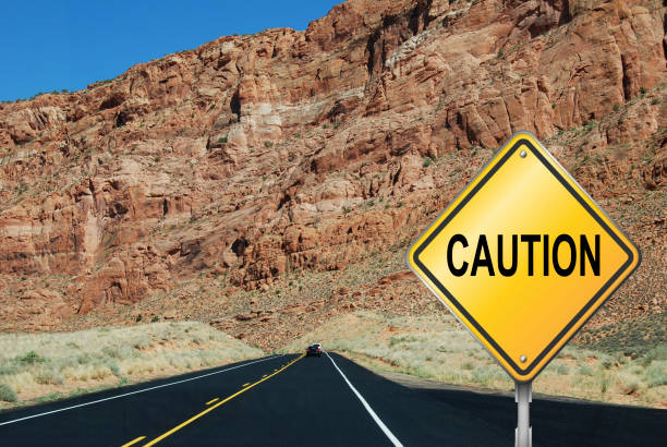 istock Road sign with rocky background 1215504940