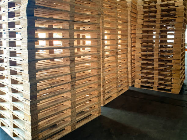 istock Stack of wooden pallets in warehouse 1215509664