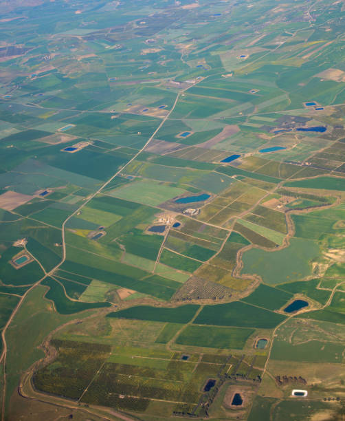 istock Aerial view from airplane over farm field 1215510893