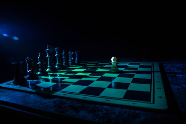 istock Chess figures on a dark background with smoke and fog. Selective focus 1215510956