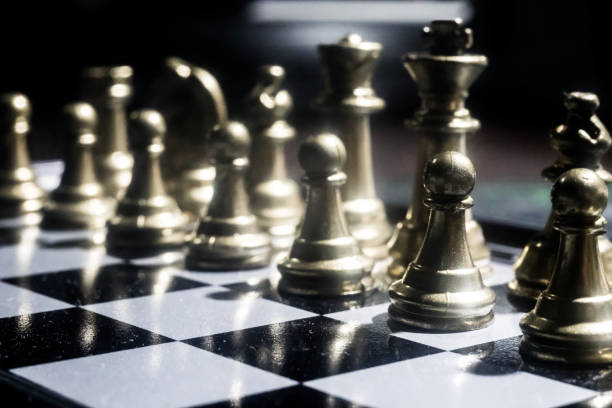 istock Chess figures on a dark background with smoke and fog. Selective focus 1215510996