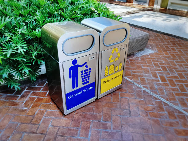istock Two Stainless Steel Trash Bins with Waste Type Labels 1215514140