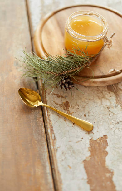 istock Honey jar on vintage wooden table. Top side view with copy space. Selective focus 1215514148
