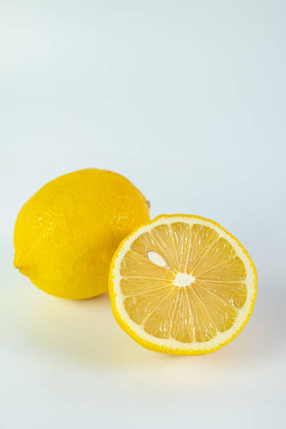 istock Sliced fresh lemon for summer drink on white background. 1215517044