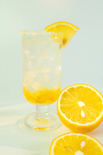 Fresh lemon soda drink iced with lemon sliced on white background.