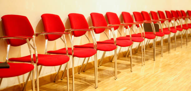 istock Rows of empty chairs waiting for the public. 1215518048