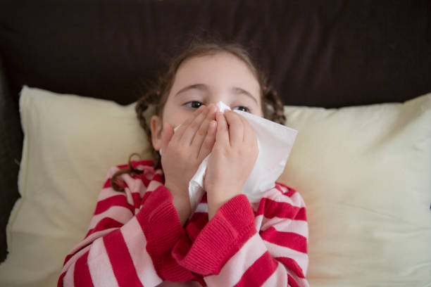istock Little Girl Cleaning Her Nose 1215518622