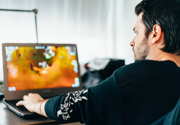 istock Gamer in quarantine playing games at home 1215518725