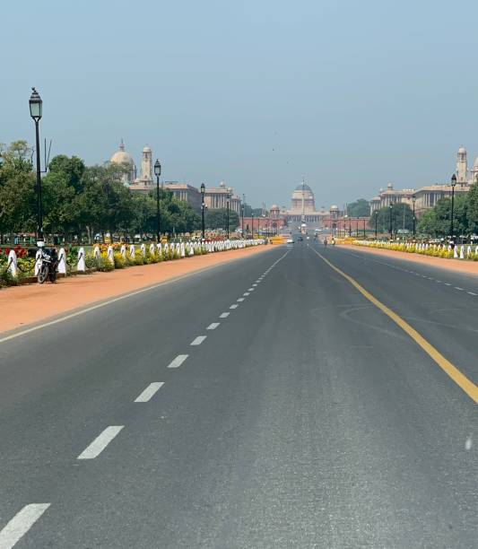 istock View of empty road in New Delhi, India 1215519478