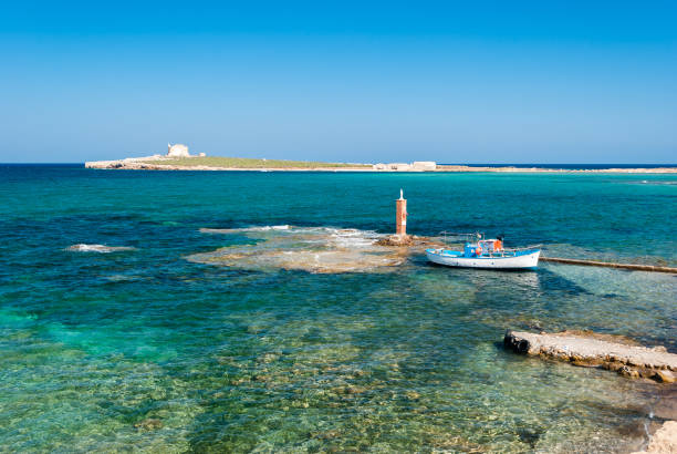 The island of "Capo Passero" in southern Sicily during the summer The island of "Capo Passero" in southern Sicily during the summer portopalo stock pictures, royalty-free photos & images