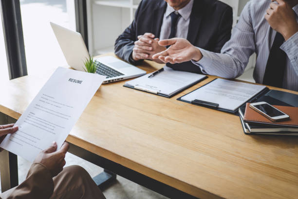 istock Job interview, Two selection committee manager asking questions to applicant about work history, colloquy dream,  Skill, expertise, experience and businessman listen to candidate answers 1215522903