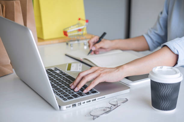 istock Woman using credit card register security code and payments online shopping and customer service network connection market, using on laptop, Internet Online shopping or internet banking concept 1215522924