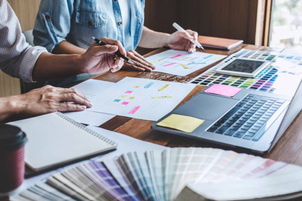 istock Team of Creative Web/Graphic Designer planning, drawing website ux app for mobile phone application and development template layout, process to developing prototype wireframe, User experience concept 1215522942