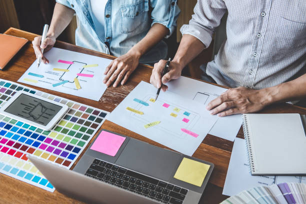 istock Team of Creative Web/Graphic Designer planning, drawing website ux app for mobile phone application and development template layout, process to developing prototype wireframe, User experience concept 1215522945