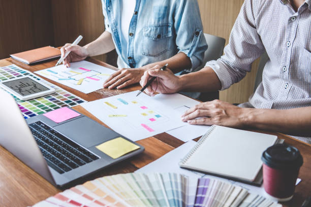 istock Team of Creative Web/Graphic Designer planning, drawing website ux app for mobile phone application and development template layout, process to developing prototype wireframe, User experience concept 1215522947