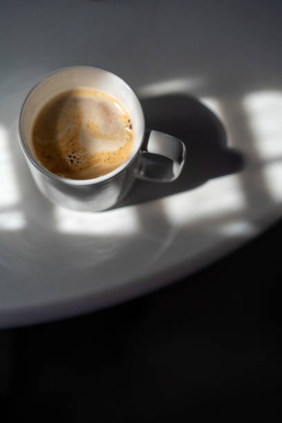 istock Homemade coffee in mug on top of white table 1215523035