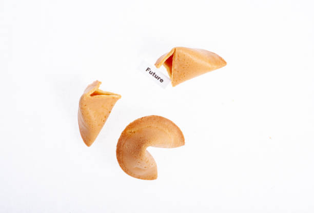 istock fortune cookie cracked open on white background with the word future 1215523098