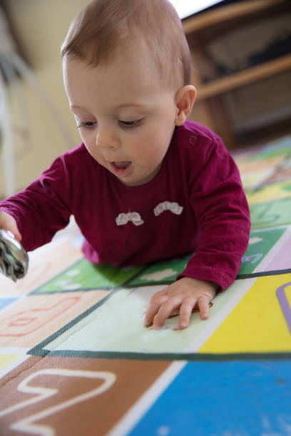 istock Baby girl crawling 1215523113