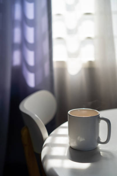 istock Homemade coffee in mug on top of white table 1215523707