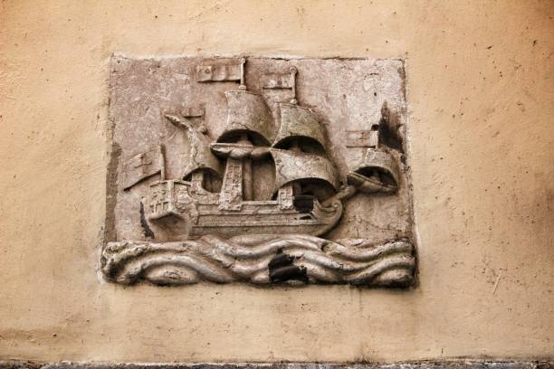 Lisbon, Portugal- March 4, 2020: Old galleon image carved on stone on a Lisbon facade