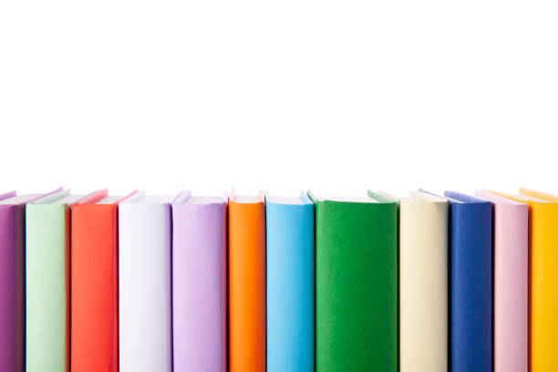 istock Stack of colorful books isolated on white background. Collection of different books. Hardback books for reading. Back to school and education learning concept. Copy space text, closeup view 1215525190