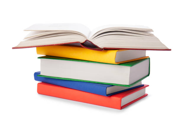 istock Stack of colorful books isolated on white background. Collection of different books. Hardback books for reading. Back to school and education learning concept 1215525193