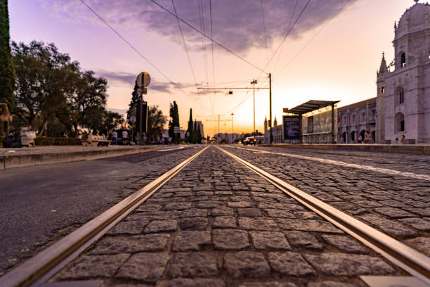 Tourists are waiting the their tramway. The street view of Av. 24 de Julho N6 close to train station of Cais do Sodre, Lisbon, Portugal.